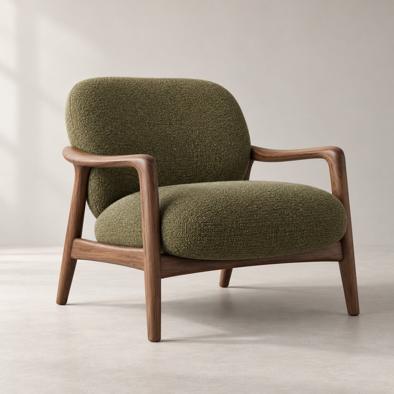 Detail of the Arc chair with textured upholstery and a walnut frame